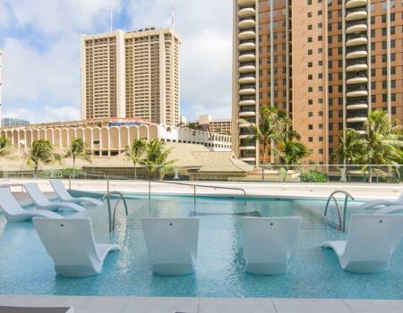 image of loungers in a pool